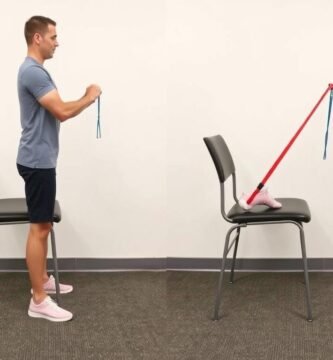 Person performing standing hamstring curls with resistance band for knee injury recovery exercises step by step